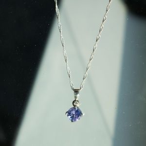 Tanzanite and diamond necklace in silver.